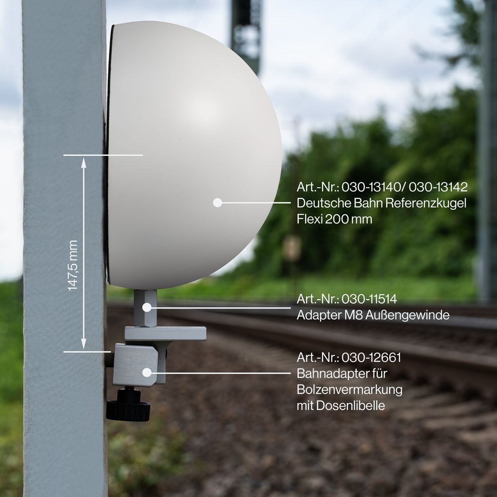 A white object is attached to a pole with measurements on it