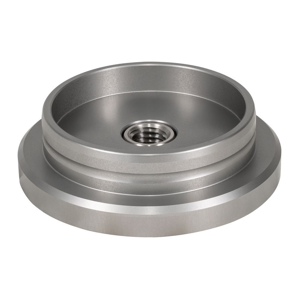 A metal object with a hole in the middle on a white background