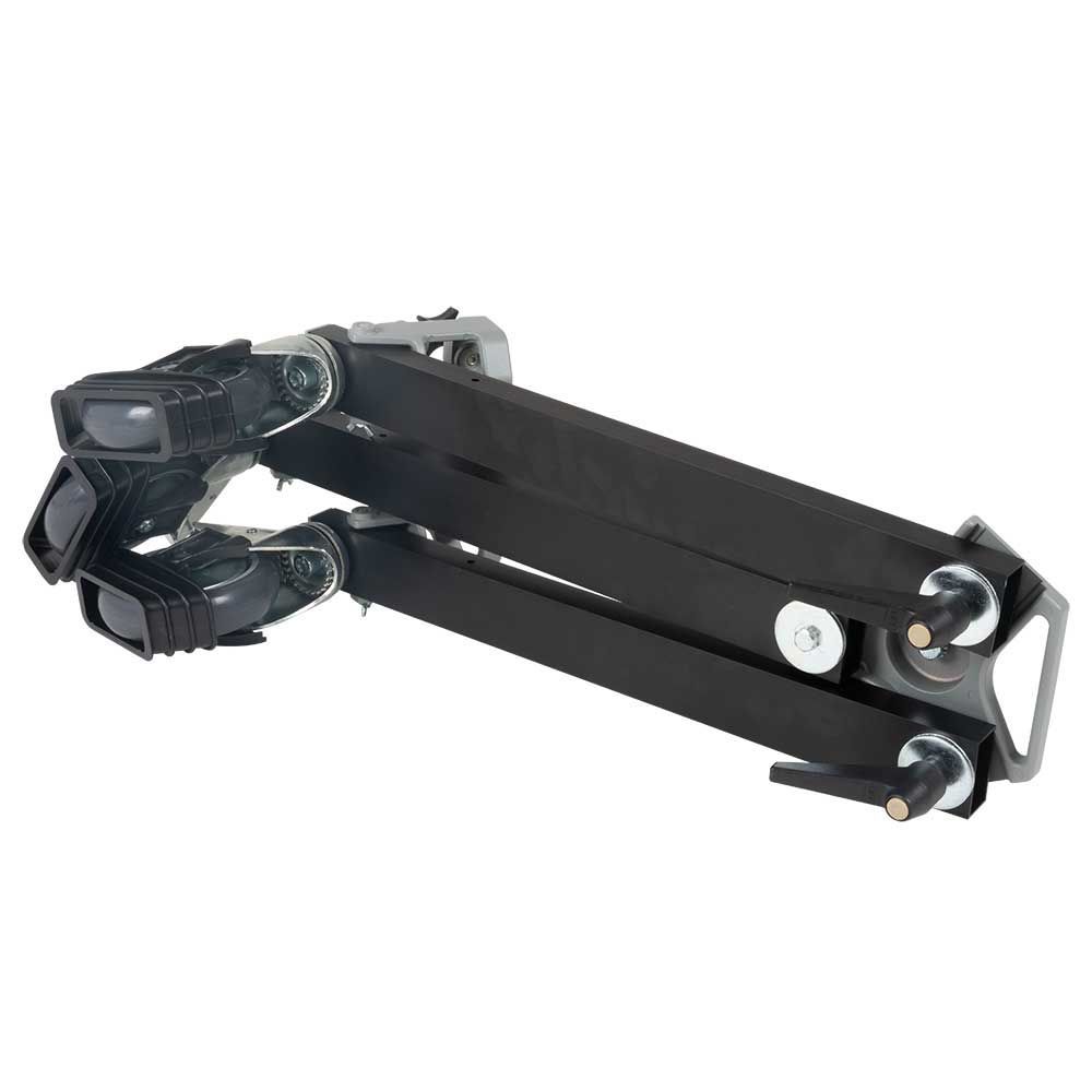 A tripod with wheels and a camera on it on a white background.