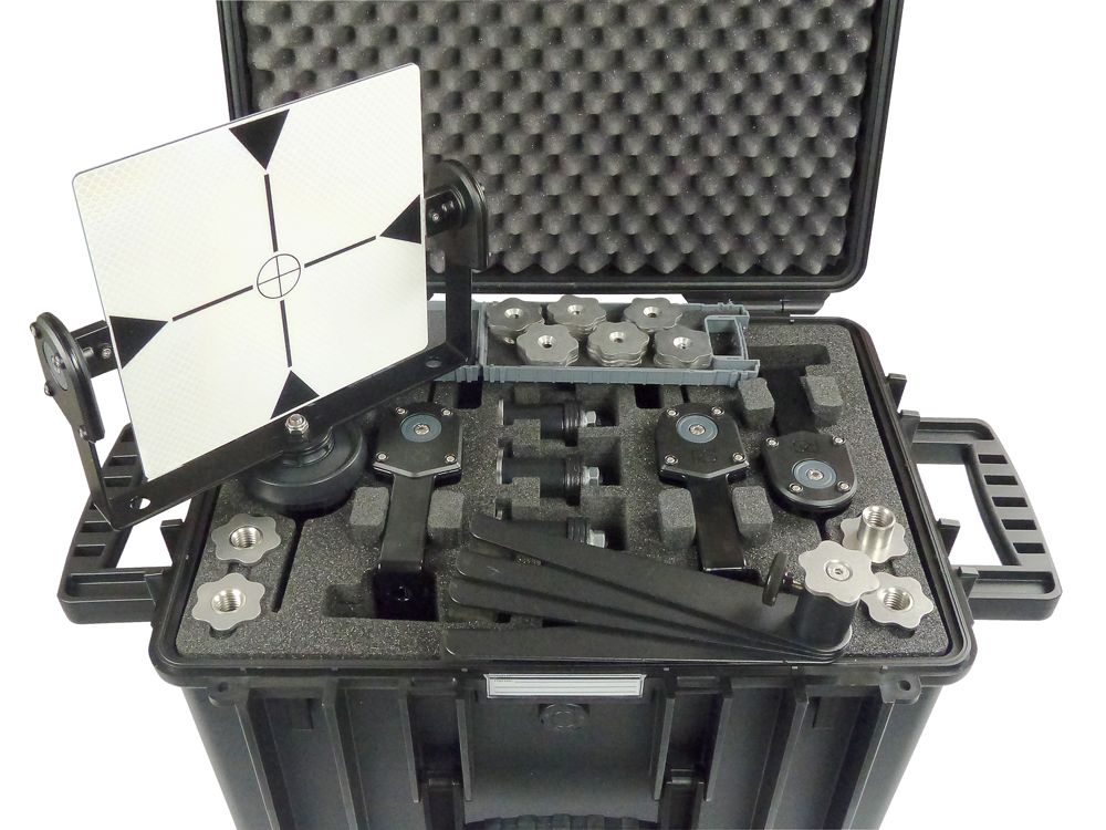 A black case filled with a bunch of equipment and a target.