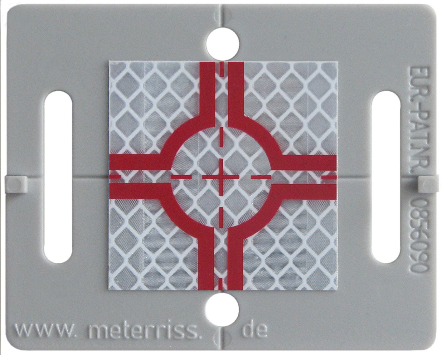 A red plastic item with a cross on it