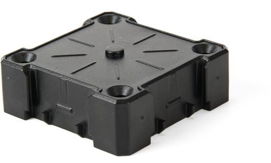 A small black box with holes in it on a white background