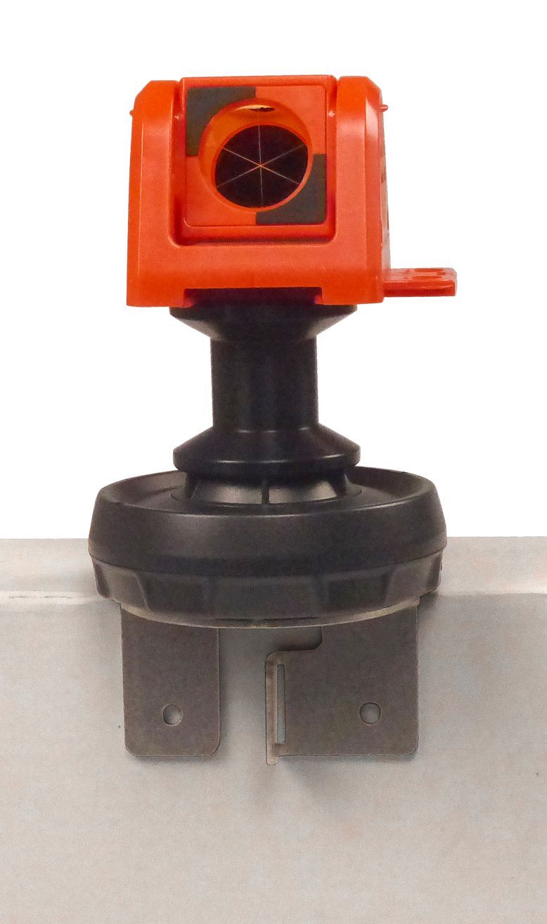 A small orange object is attached to a metal object