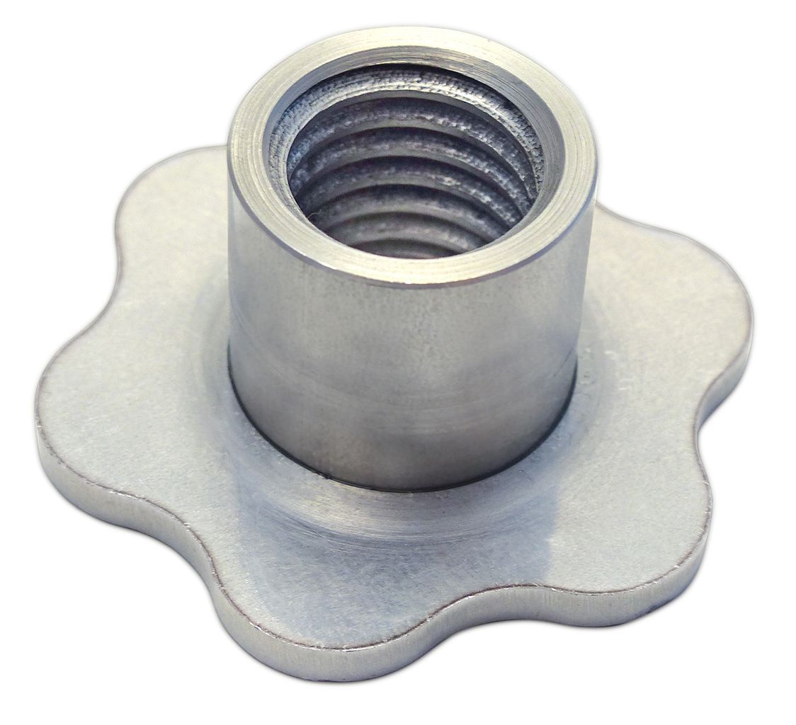 A close up of a metal nut on a white background