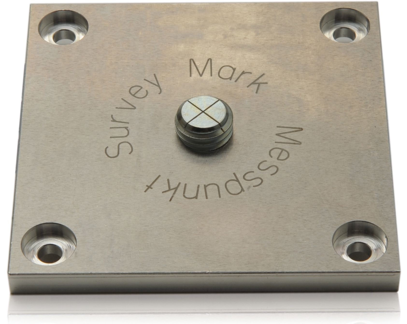 A square piece of metal that says survey mark messpunkt