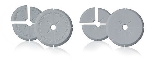 A group of gray circles with holes in them on a white surface.