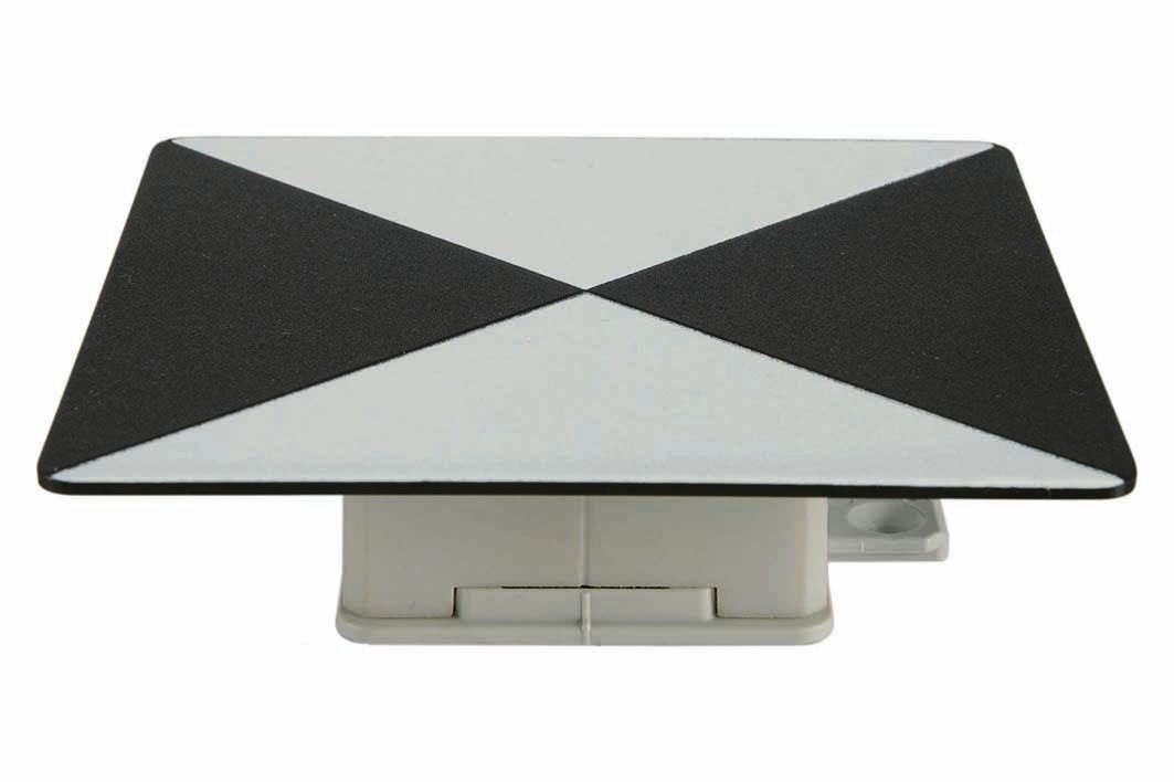 A black and white triangle on a white surface