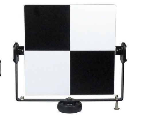 A black and white checkered board on a stand