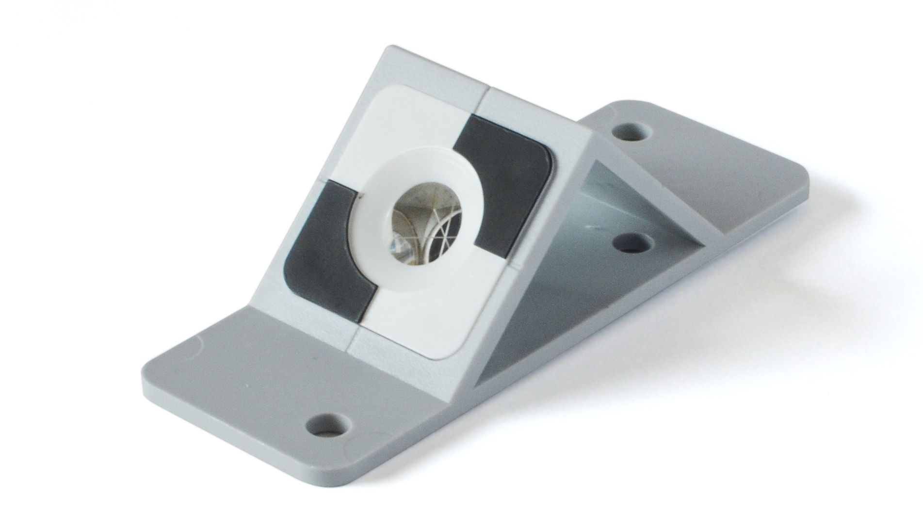 A metal bracket with a hole in the middle on a white background.