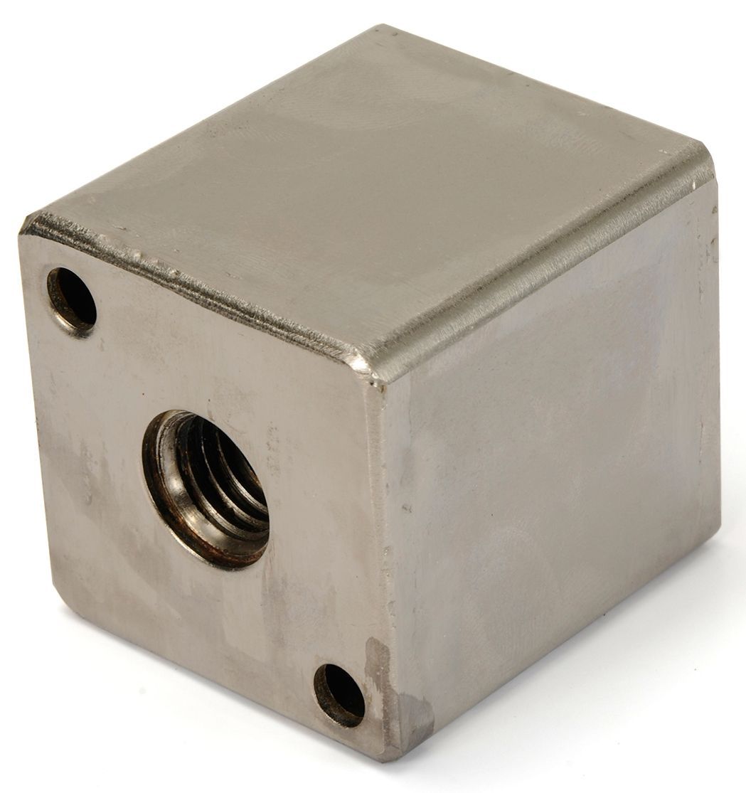 A stainless steel cube with a hole in the middle