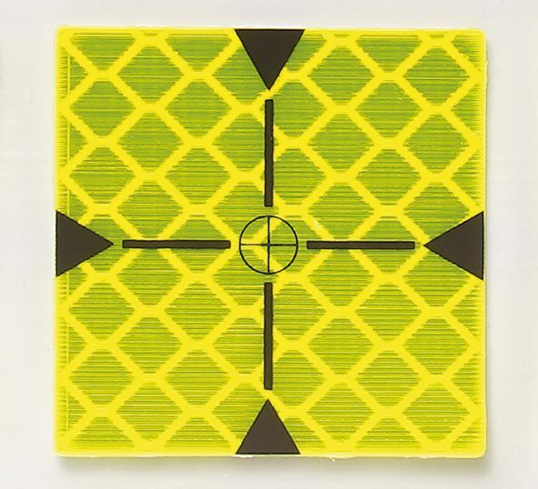 A yellow and black square with a cross in the middle