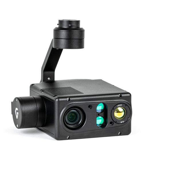 A black camera with two lenses is sitting on a white surface.
