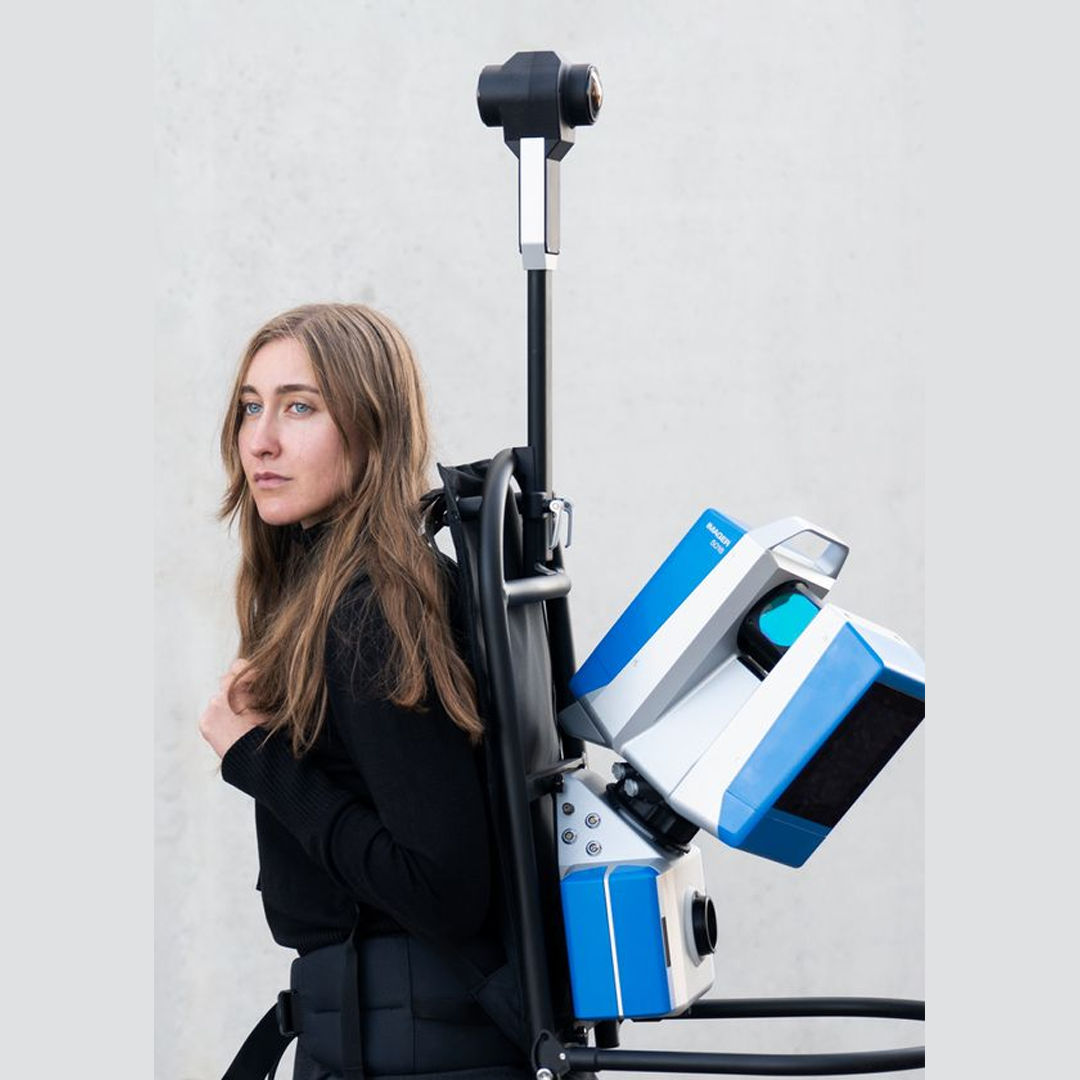 A blue and white scanner with a screen on it
