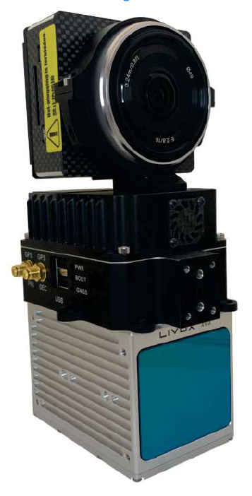 A camera is sitting on top of a white box.