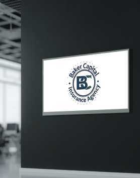 Logo of Baker Capital Insurance Agency on a wall, with a dark blue circular logo against a white background.