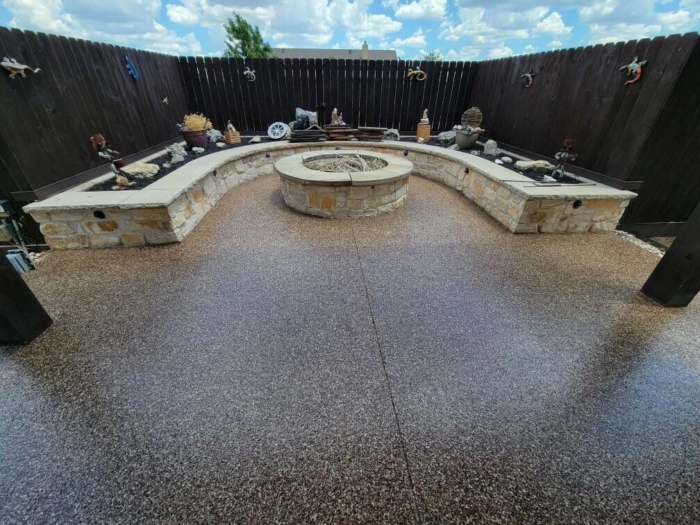 beautiful house patio with concrete floor coating and black wooden gate
