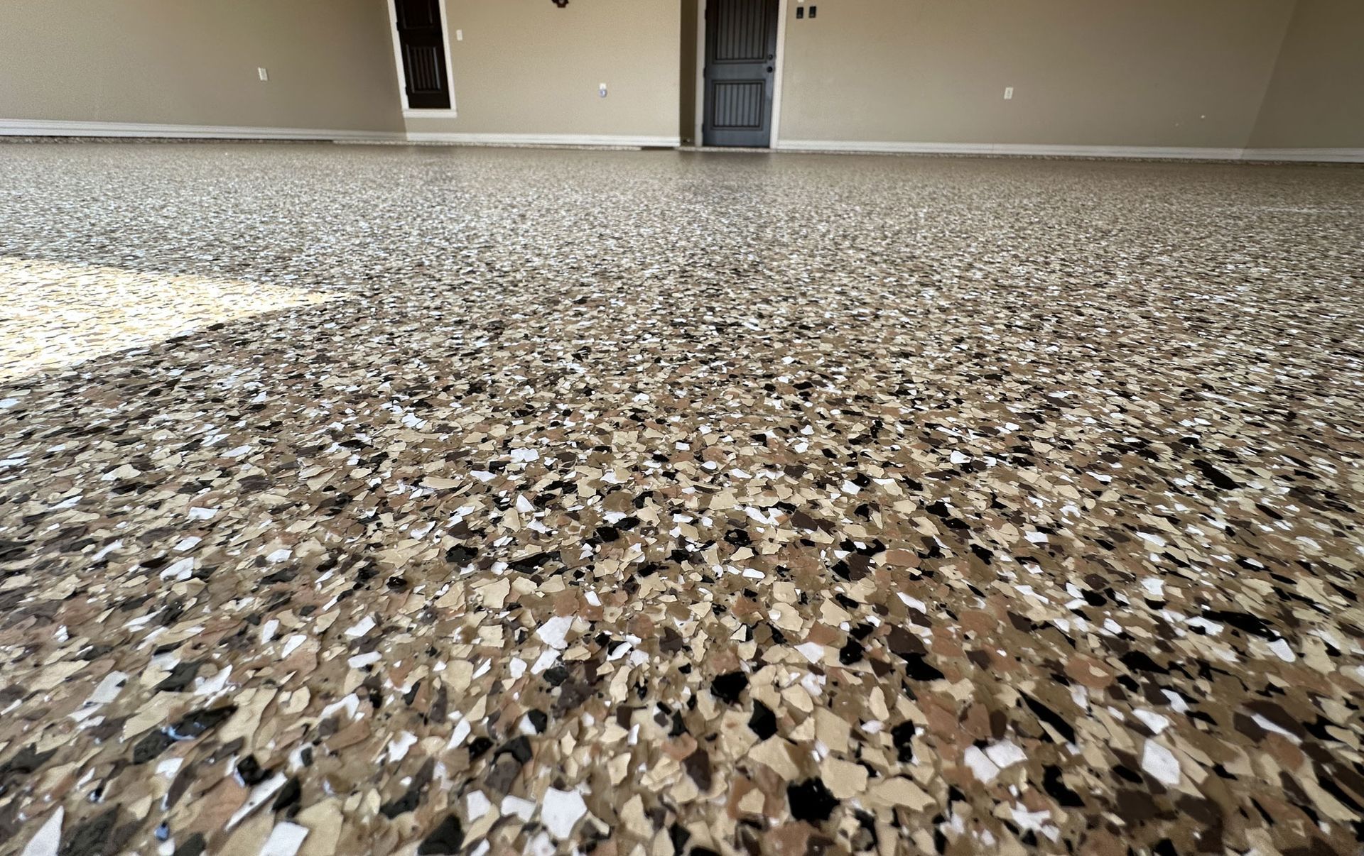 close up of an open double door to a room with polyurethane or polyurea floor coating