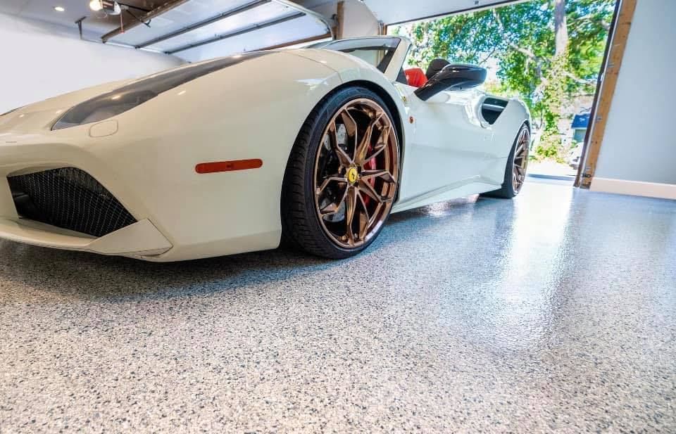white sports car in a garage with polyurethane or polyurea floor coating