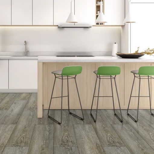 A kitchen with white cabinets and green stools