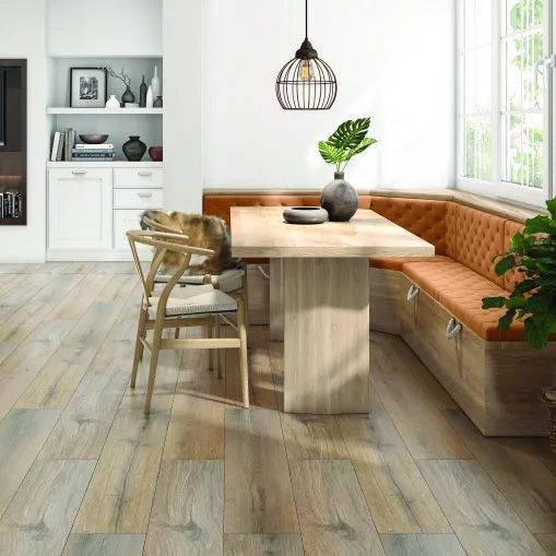 A dining room with a table , chairs , and a bench.