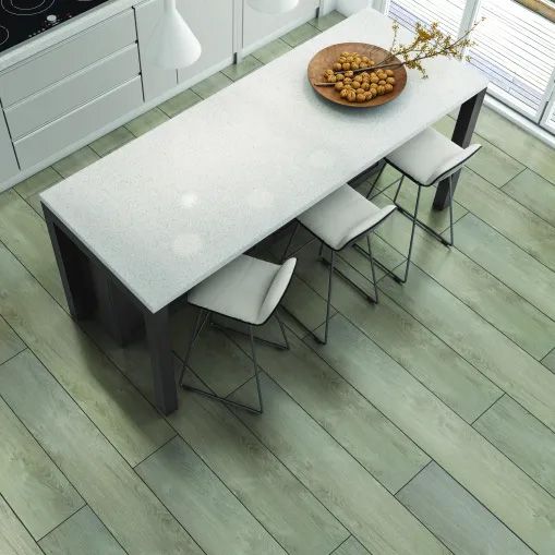 An aerial view of a kitchen with a table and chairs