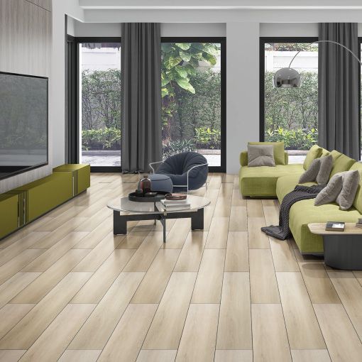 A living room with a couch , chair , coffee table and television.