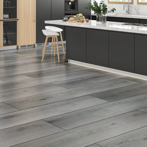 A kitchen with a LVP wooden floor and black cabinets