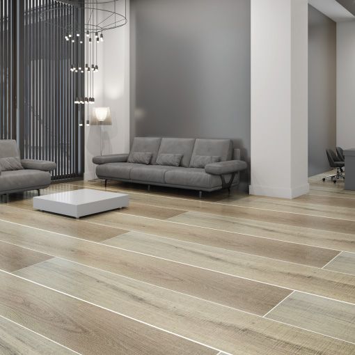 A living room with a couch , chairs , and a coffee table.