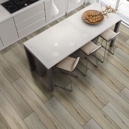 An aerial view of a kitchen with a table and chairs