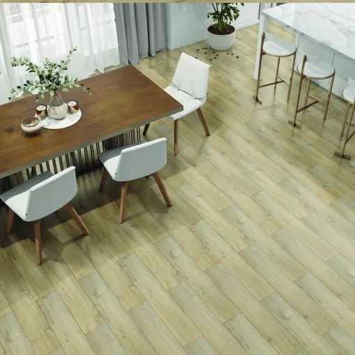 A dining room with a LVP wooden table and chairs.
