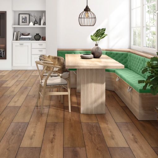 A dining room with a wooden table and chairs and a green bench.