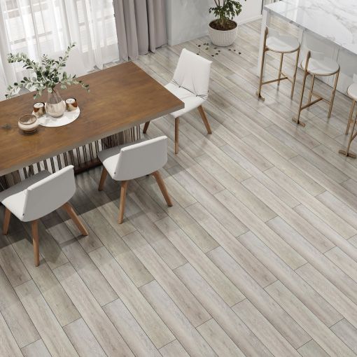 A dining room with a wooden table and white chairs.
