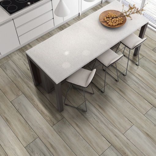 An aerial view of a kitchen with a table and chairs