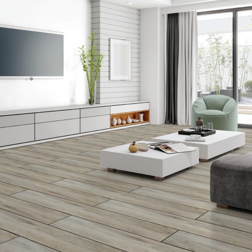 A living room with two coffee tables and a flat screen tv.