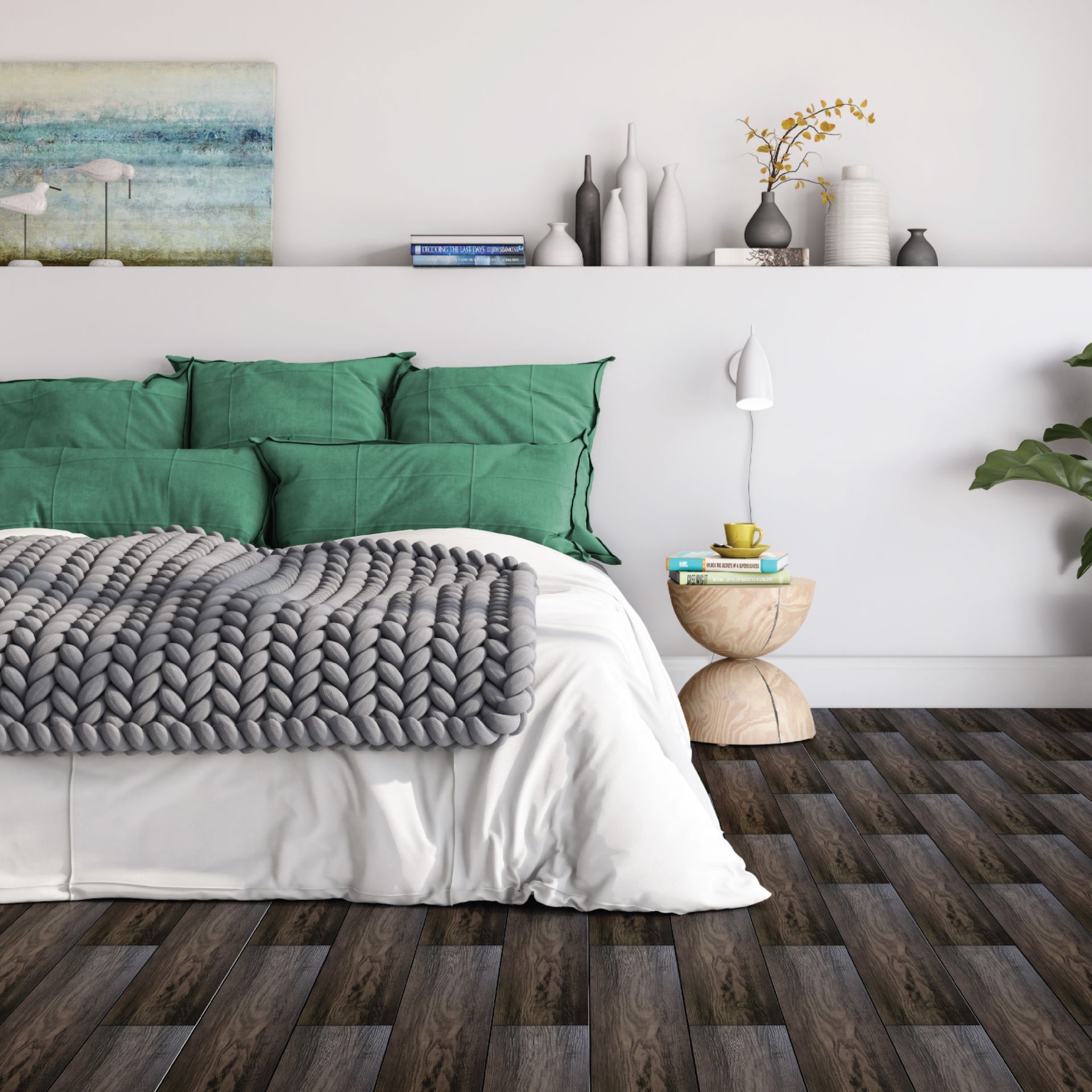 A bedroom with a bed with green pillows and a knitted blanket