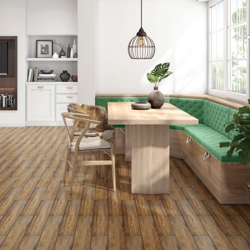 A dining room with a wooden table and chairs and a green bench.