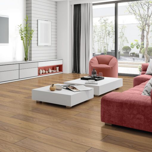 A living room with a red couch and a white coffee table