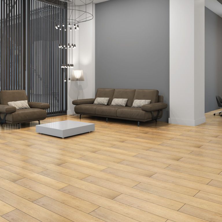A living room with a couch , chairs and a coffee table