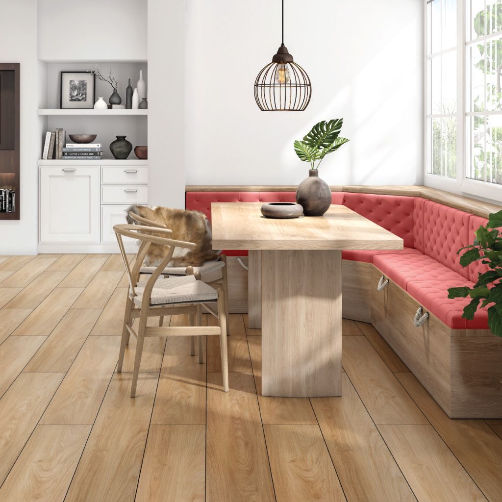 A dining room with a table and chairs and a bench