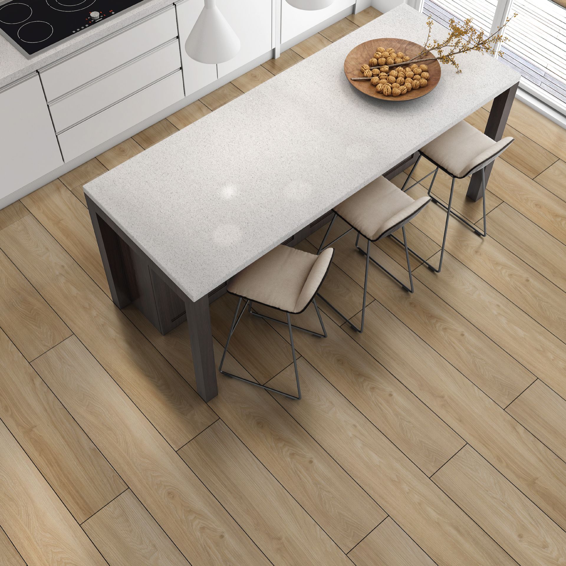A kitchen with a table and chairs and a bowl of nuts on it