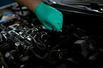 Technician Performing An Engine Oil Change | Jim’s Service Auto Repair