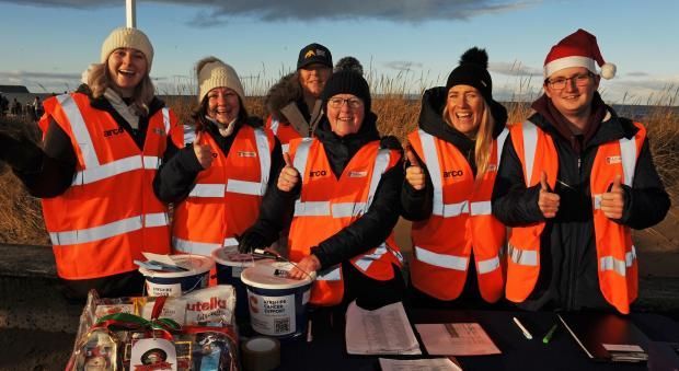 Ayrshire Cancer support team  wearing santa hats posing for a picture at the Ayrshire Cancer Big Dip event