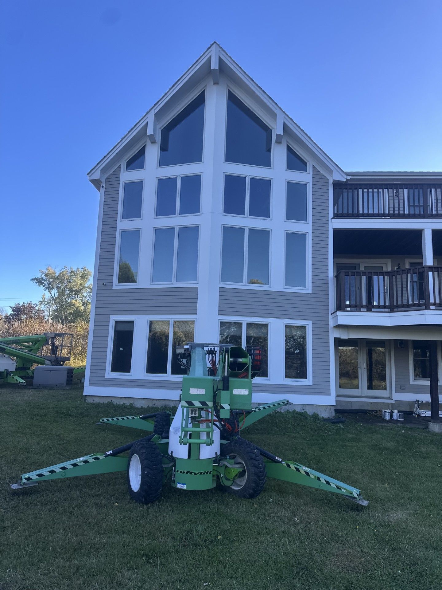 Biddeford home after exterior painting with lift.