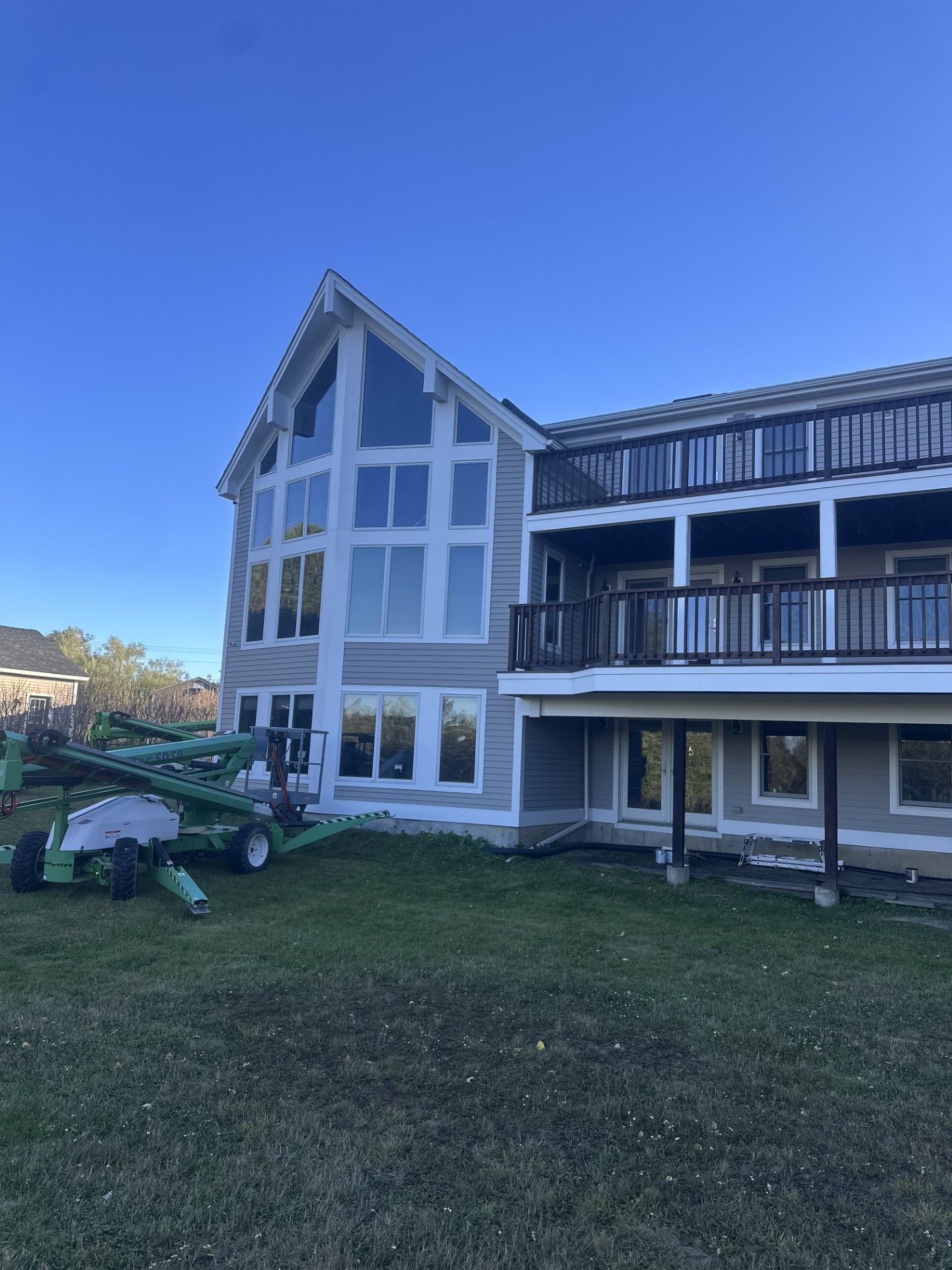 Biddeford Maine exterior painting with lift. Gutter cleaning as well.