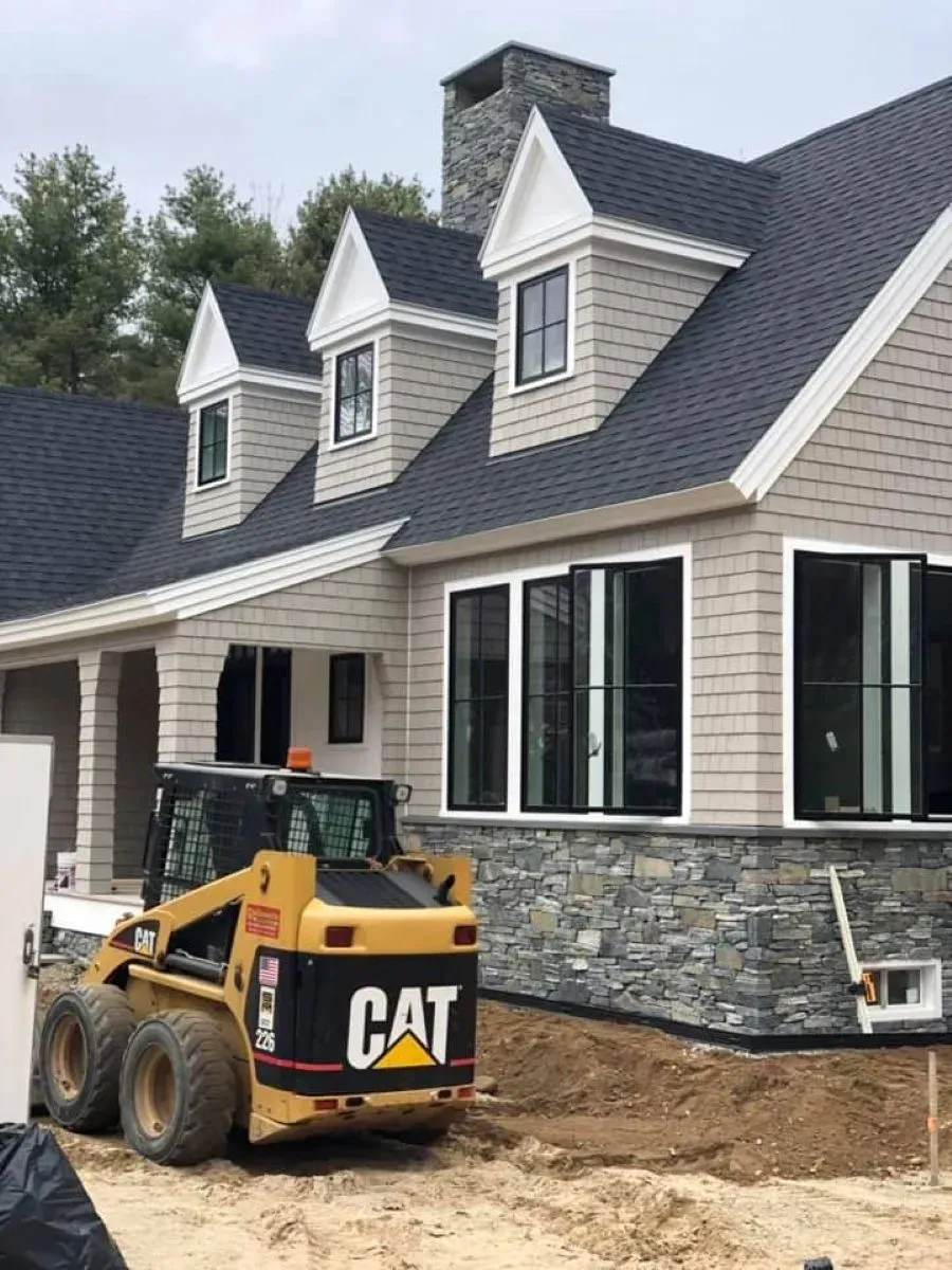 warm greige exterior paint on a Maine Cape-style home