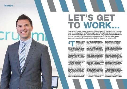 Businessman in gray suit beside a magazine page titled “LET’S GET TO WORK”