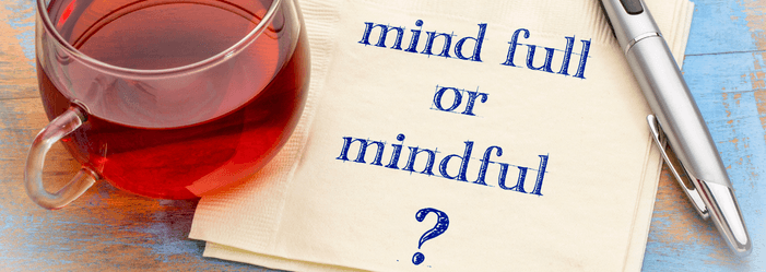 Glass of tea next to napkin with text 