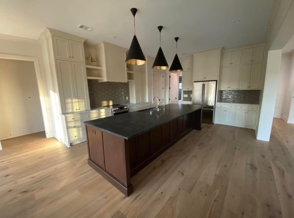 There is a large island in the middle of the kitchen.