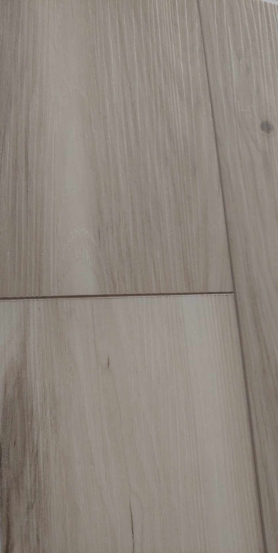A close up of a wooden floor with a few lines on it.