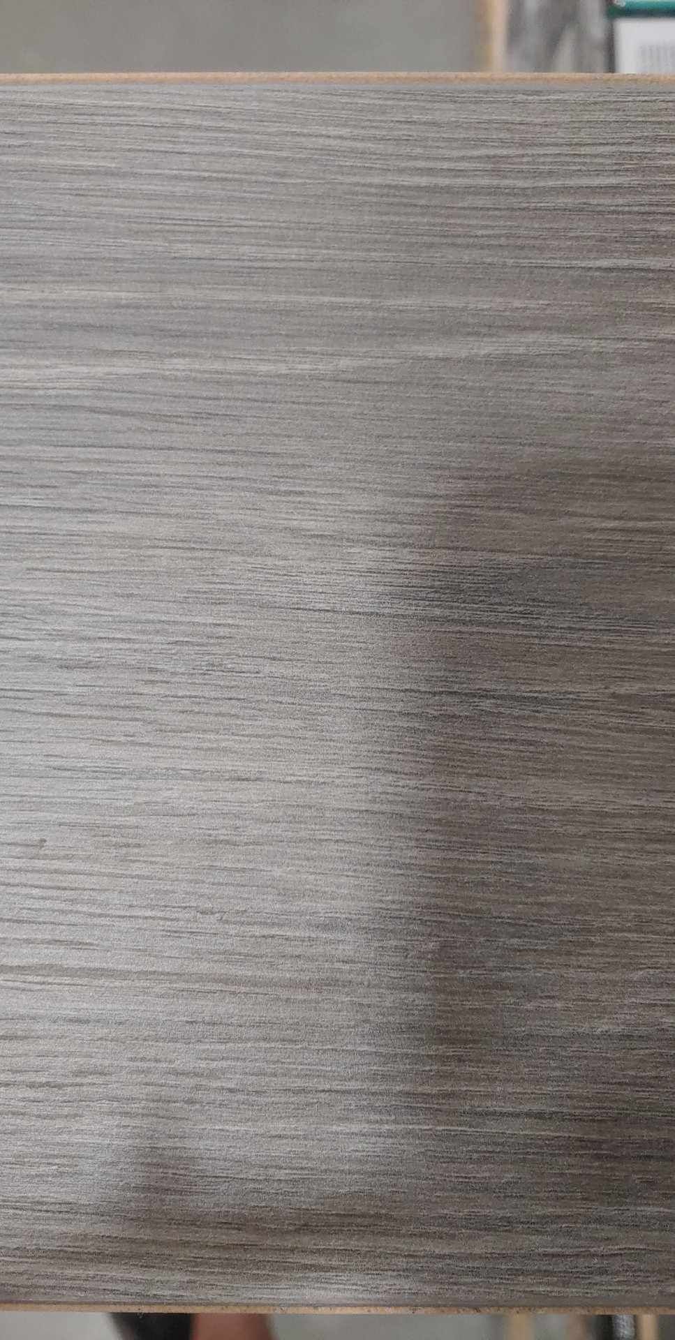 A close up of a piece of wood sitting on top of a table.